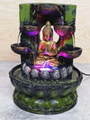 A resin table-top fountain featuring a statue of Lord Buddha, with water flowing around or from the statue.