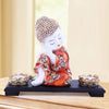 Captivating baby Buddha idol crafted from resin and marble, accompanied by a wooden tray and two tealight holders, symbolizing wisdom and tranquility