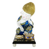 Blue Baby Buddha statue adorned with mirrors and fancy stones, accompanied by a wooden platform, fancy flower, and tealight holder