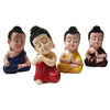 Collection of four serene Buddha monk statues made from durable resin, ideal for indoor and outdoor decor, promoting tranquility and harmony