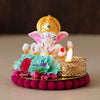 Handmade Ganesha idol made from resin, featuring intricate details and vibrant colors, ideal for home altars and car dashboards, measuring 9 cm x 9 cm x 7.5 cm