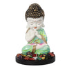 Serene polyresin statue of a young monk in deep contemplation, featuring soft green and white hues, with a natural wood base and tealight holder.