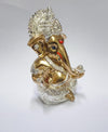 Compact resin Ganesha idol for car dashboard, 5.1x5.1x8.9 cm, 300g, symbolizing spiritual protection and blessings. Perfect for travel and Hindu faith gifting.