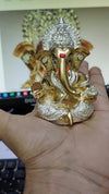 Compact resin Ganesha idol for car dashboard, 5.1x5.1x8.9 cm, 300g, symbolizing spiritual protection and blessings. Perfect for travel and Hindu faith gifting.