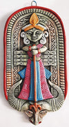 Handcrafted terracotta wall hanging of Goddess Durga, showcasing intricate details and rustic elegance, symbolizing protection and spirituality